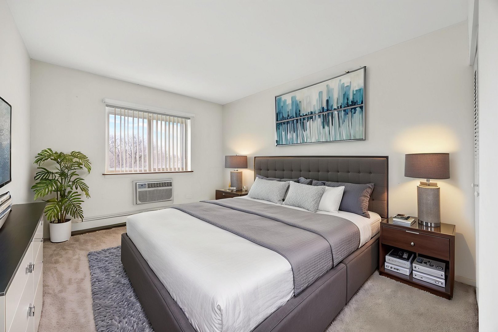 1321 South Finley Road, Unit 416 Lombard, IL 60148 - Photo 11 of 19 a bedroom with a bed and a couch