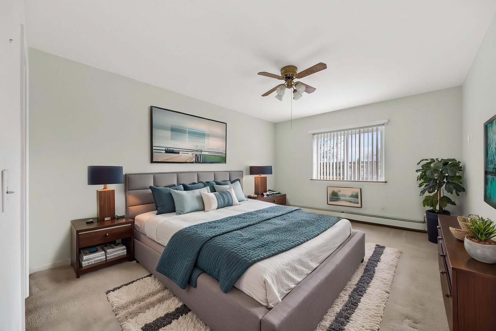 1321 South Finley Road, Unit 416 Lombard, IL 60148 - Photo 14 of 19 a bedroom with a large bed and a chandelier