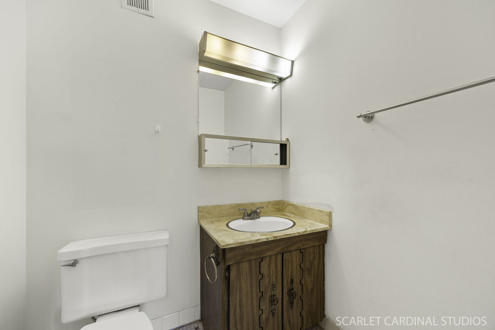 1321 South Finley Road, Unit 416 Lombard, IL 60148 - Photo 17 of 19 a bathroom with a sink a toilet and mirror