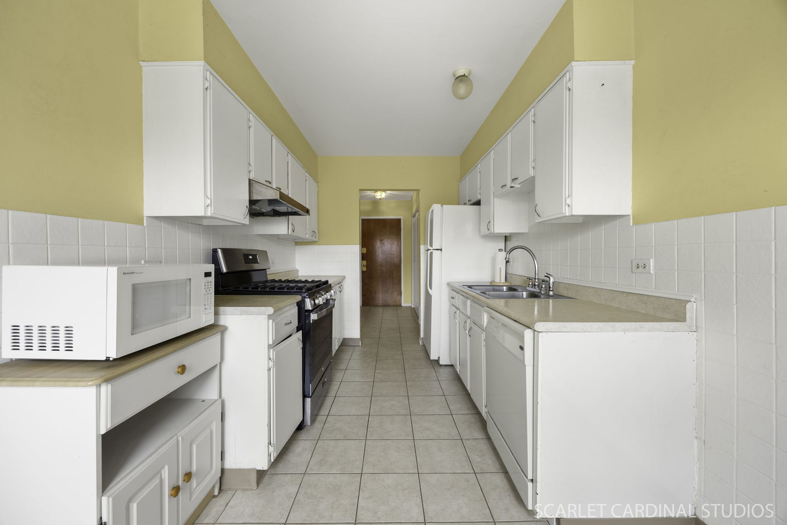 1321 South Finley Road, Unit 416 Lombard, IL 60148 - Photo 9 of 19 a kitchen with stainless steel appliances granite countertop a sink and cabinets