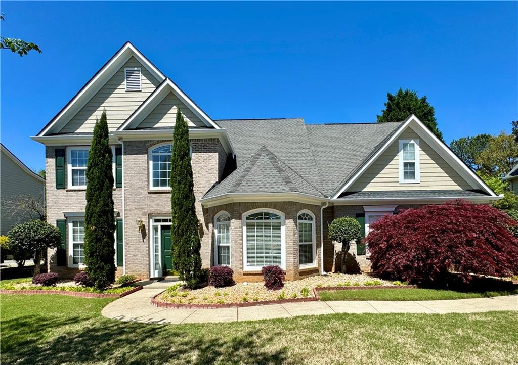 60 Ruby Forest Parkway Suwanee, GA 30024 - Photo 1 of 1 a front view of a house with a yard