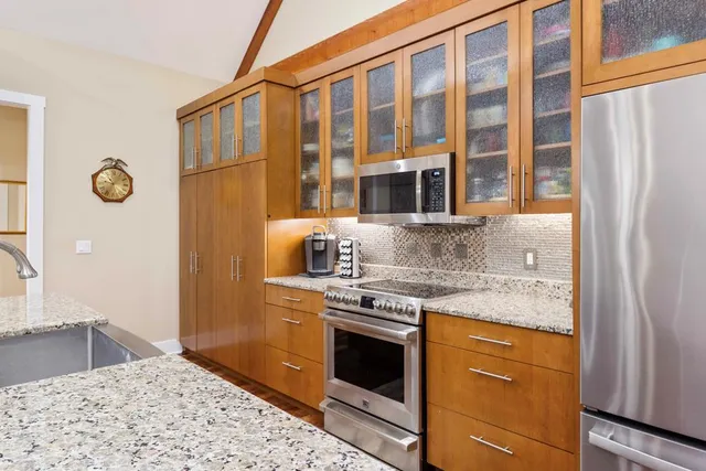 a view of a chairs and table in a backyard