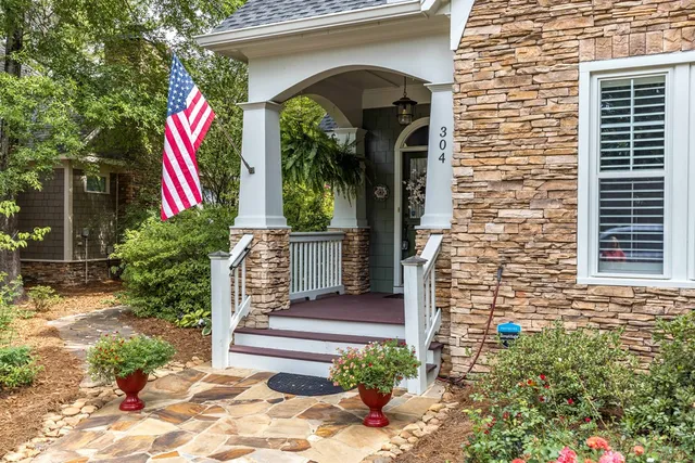a front view of house with yard outdoor seating and barbeque oven