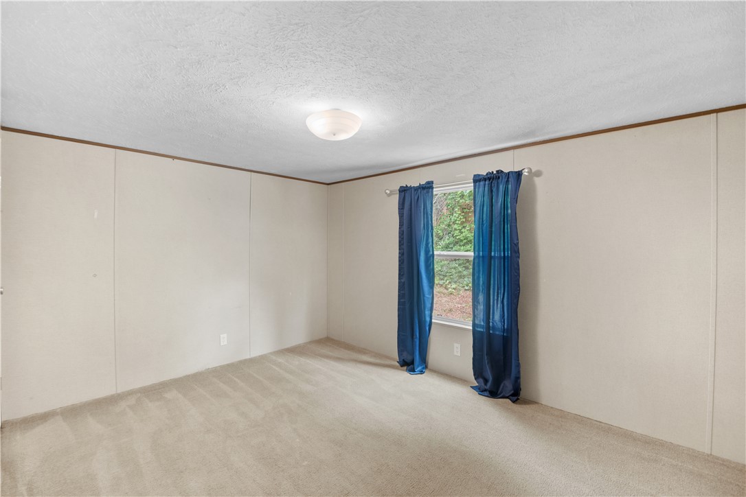 1188 Old Liberty Road Easley, SC 29640 - Photo 26 of 28 This airy room offers a blank canvas for personalization, complete with abundant natural light.