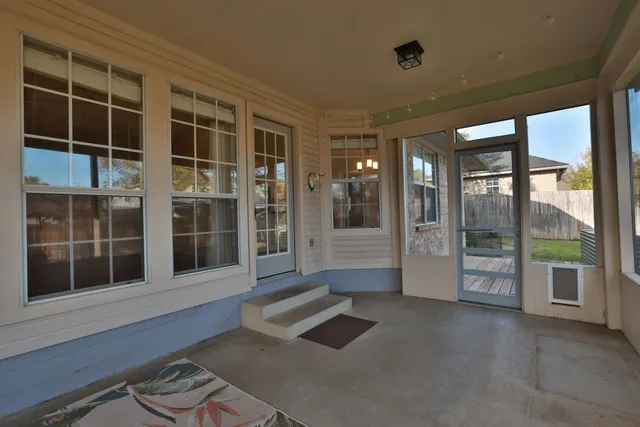 a view of an entryway with a floor to ceiling window