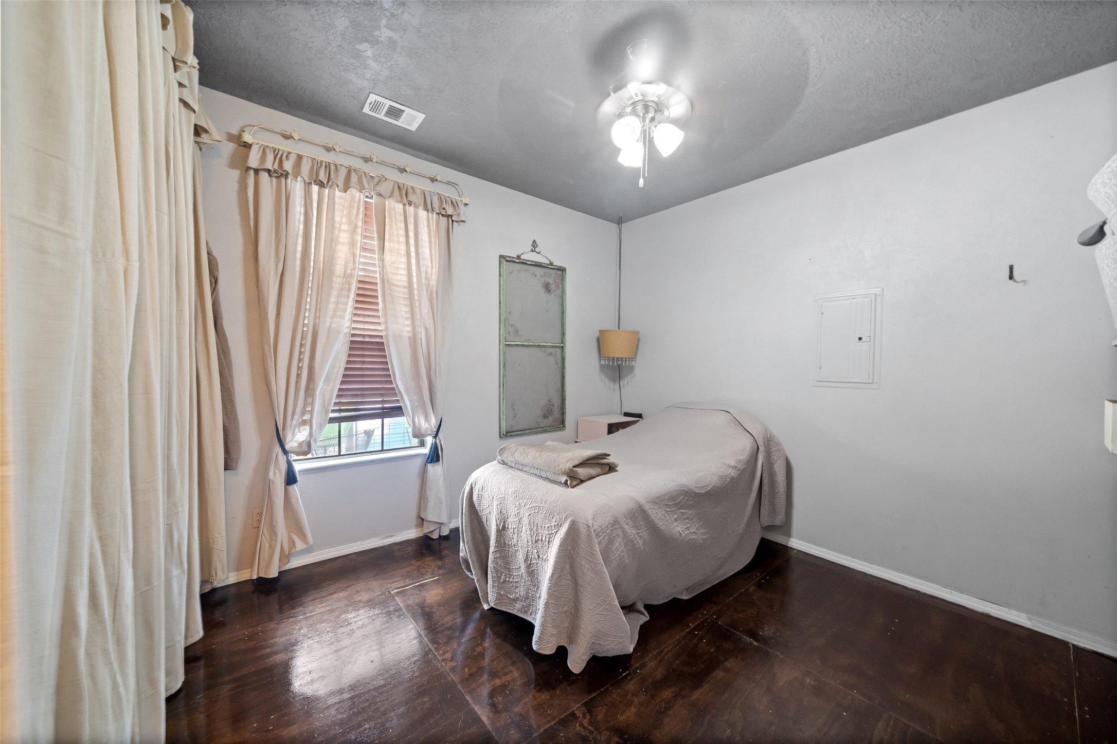26407 Preston Avenue Spring, TX 77373 - Photo 24 of 38 a bed sitting in a spacious bedroom next to a window