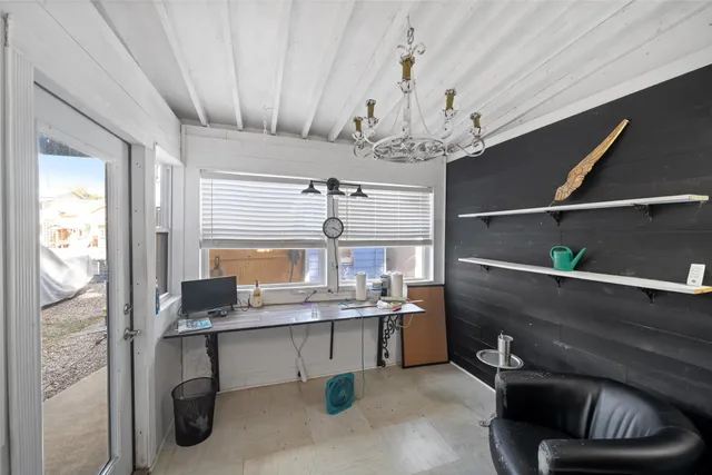 a kitchen with a refrigerator and a stove