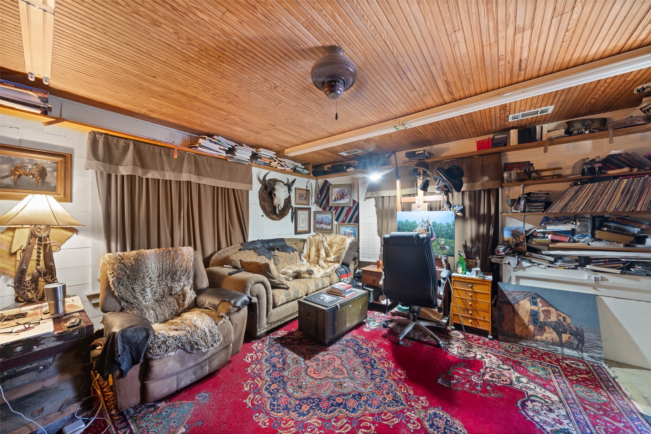 26407 Preston Avenue Spring, TX 77373 - Photo 30 of 38 a living room with lots of furniture and clothes