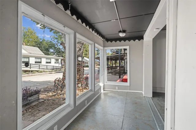 a view of an empty room with glass door