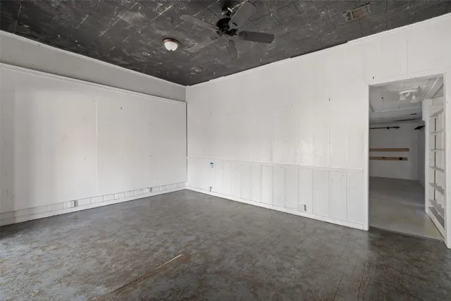 a view of a hallway with a kitchen