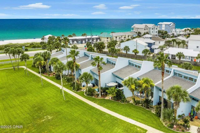an aerial view of a house with a big yard