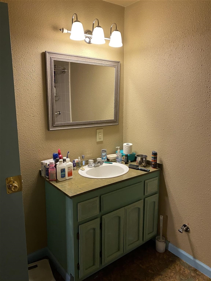 7313 Riata Way Angels Camp, CA 95222 - Photo 34 of 37 a bathroom with a sink and a mirror