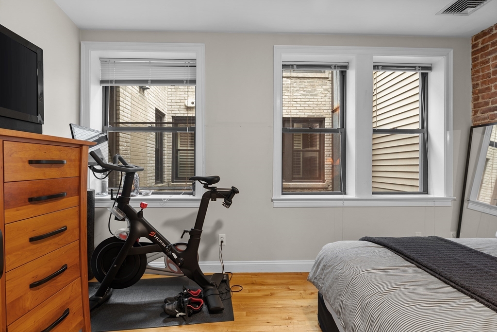 454 Hanover Street, Unit 5 Boston, MA 02113 - Photo 12 of 19 a view of a workspace with furniture and a window