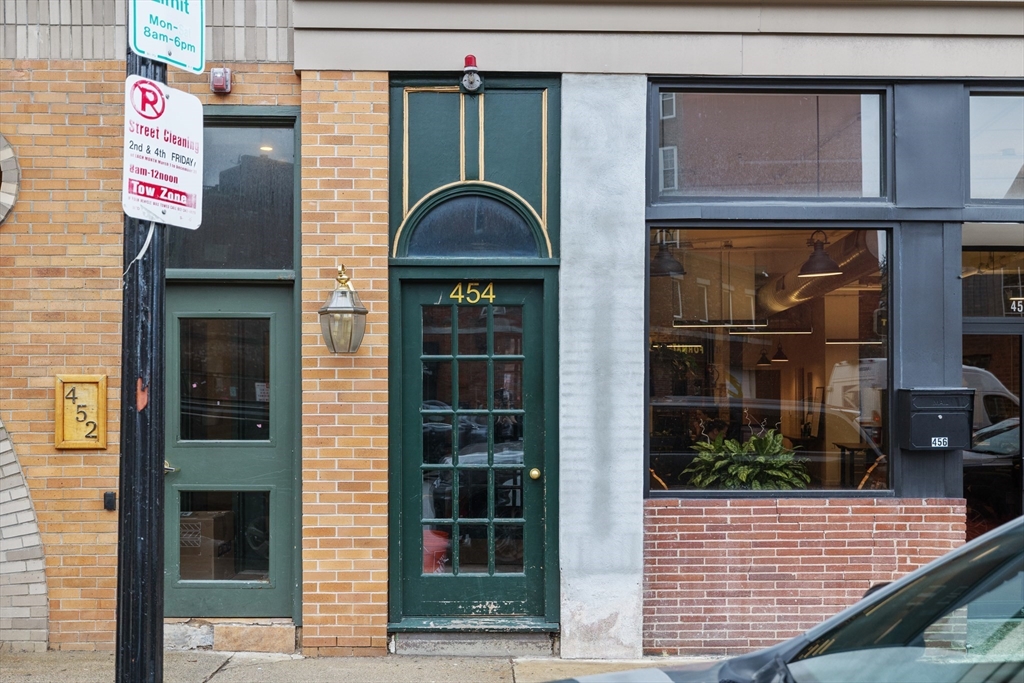 454 Hanover Street, Unit 5 Boston, MA 02113 - Photo 19 of 19 a front view of a house with a garden