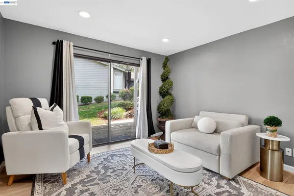 a living room with furniture and a window