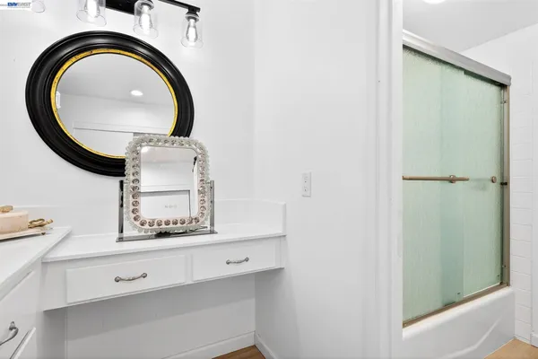 a bathroom with a mirror and a sink