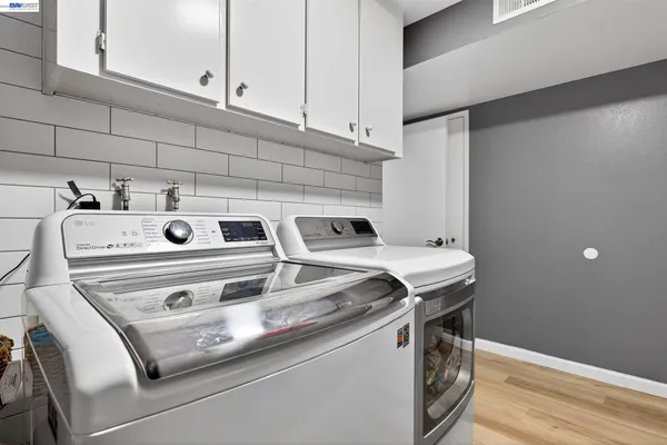 a utility room with dryer and washer