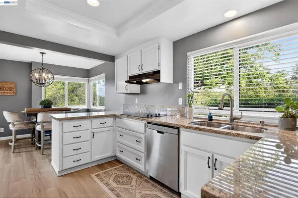 a kitchen with cabinets a window and a sink