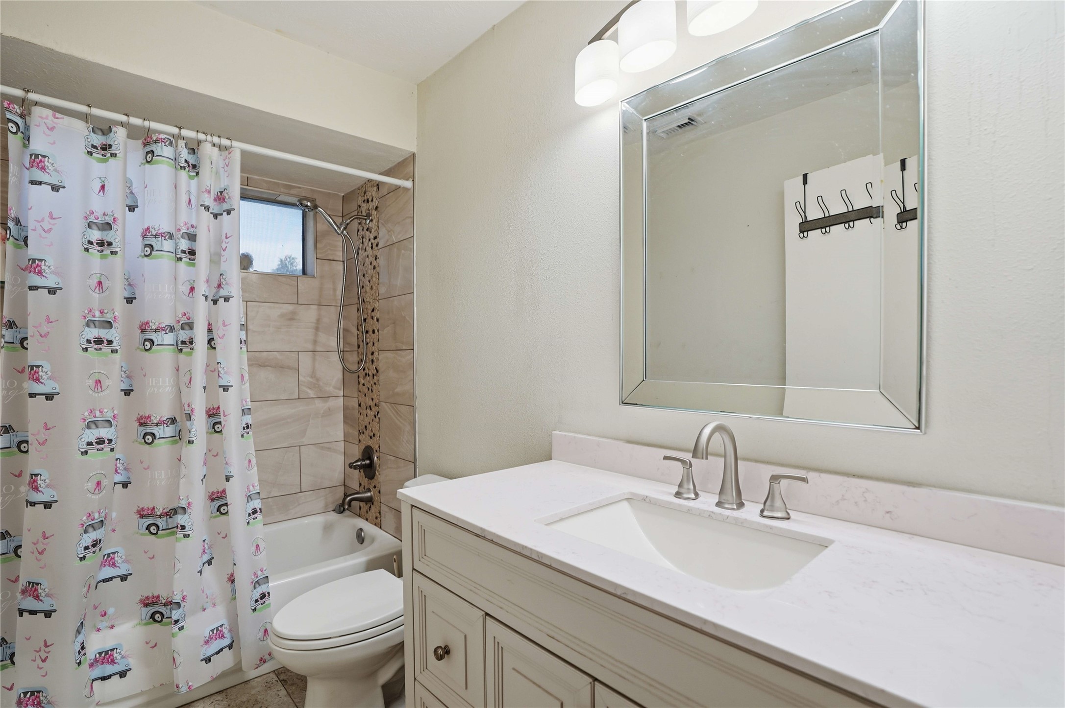 15258 Ferness Lane Channelview, TX 77530 - Photo 12 of 16 a bathroom with a granite countertop sink toilet and shower