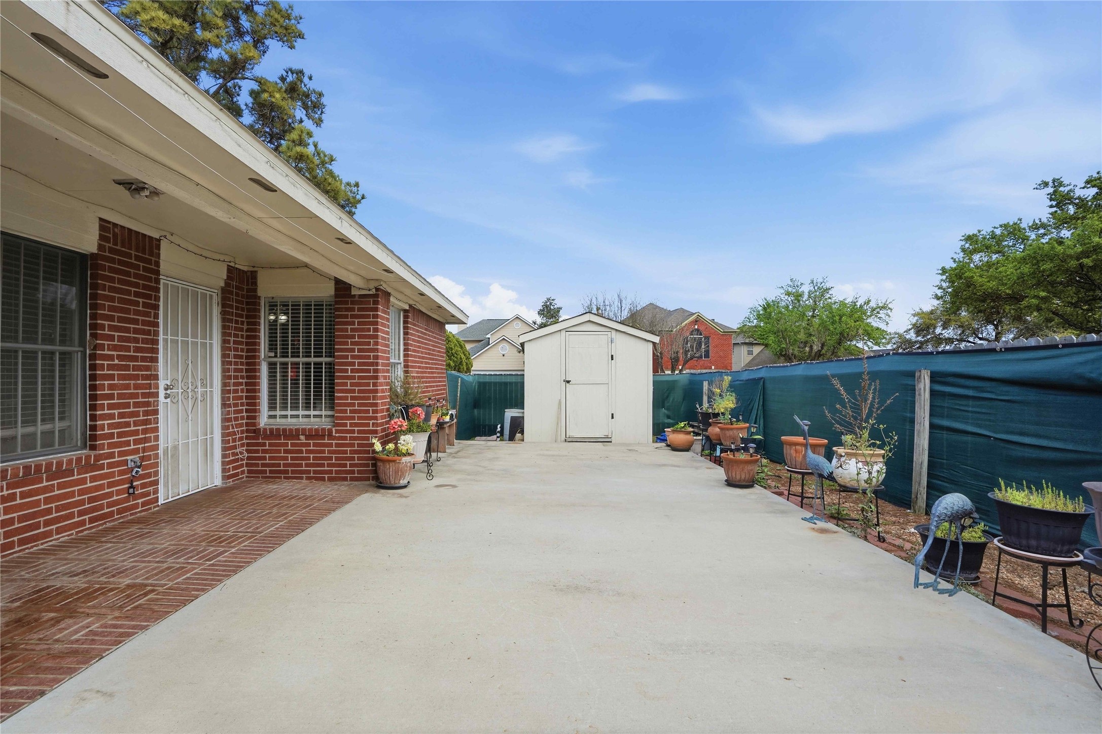 15258 Ferness Lane Channelview, TX 77530 - Photo 13 of 16 a view of a house with backyard and sitting area
