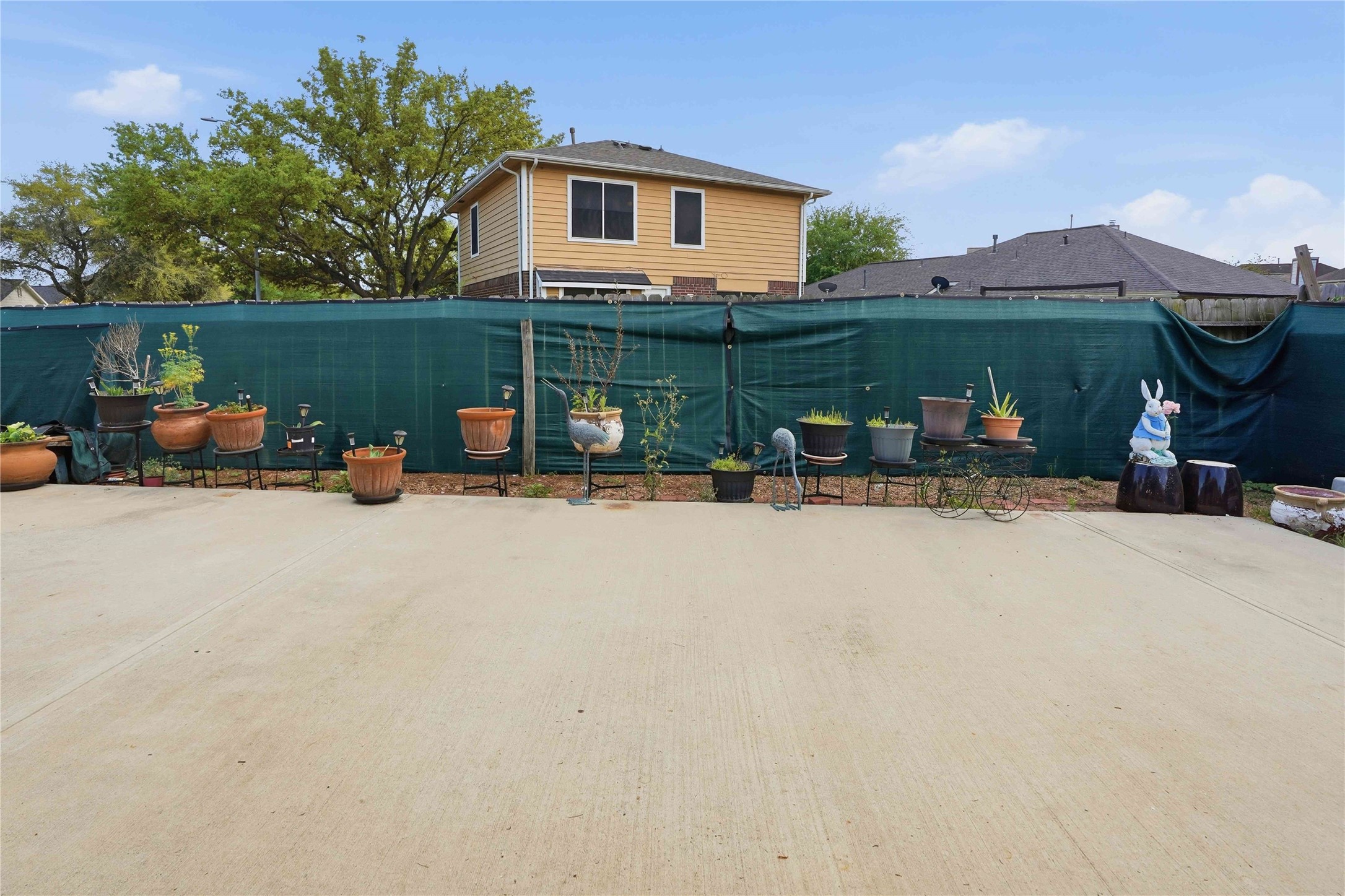 15258 Ferness Lane Channelview, TX 77530 - Photo 15 of 16 a view of a patio with table and chairs under an umbrella