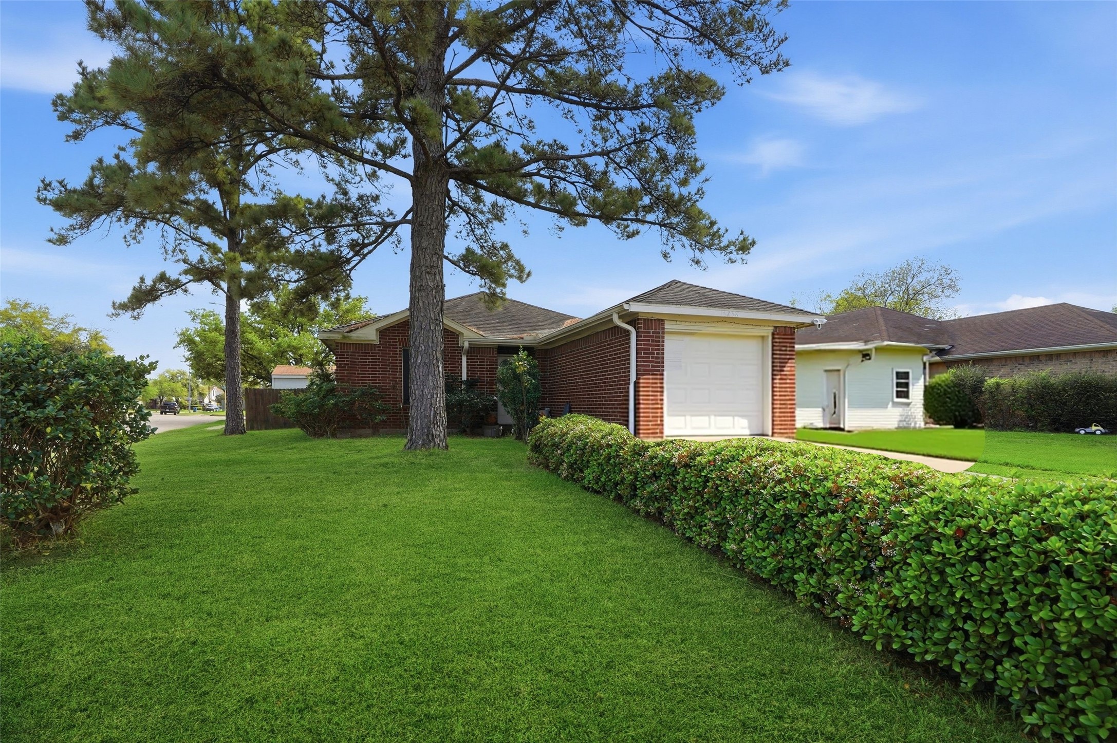 15258 Ferness Lane Channelview, TX 77530 - Photo 2 of 16 a front view of a house with garden
