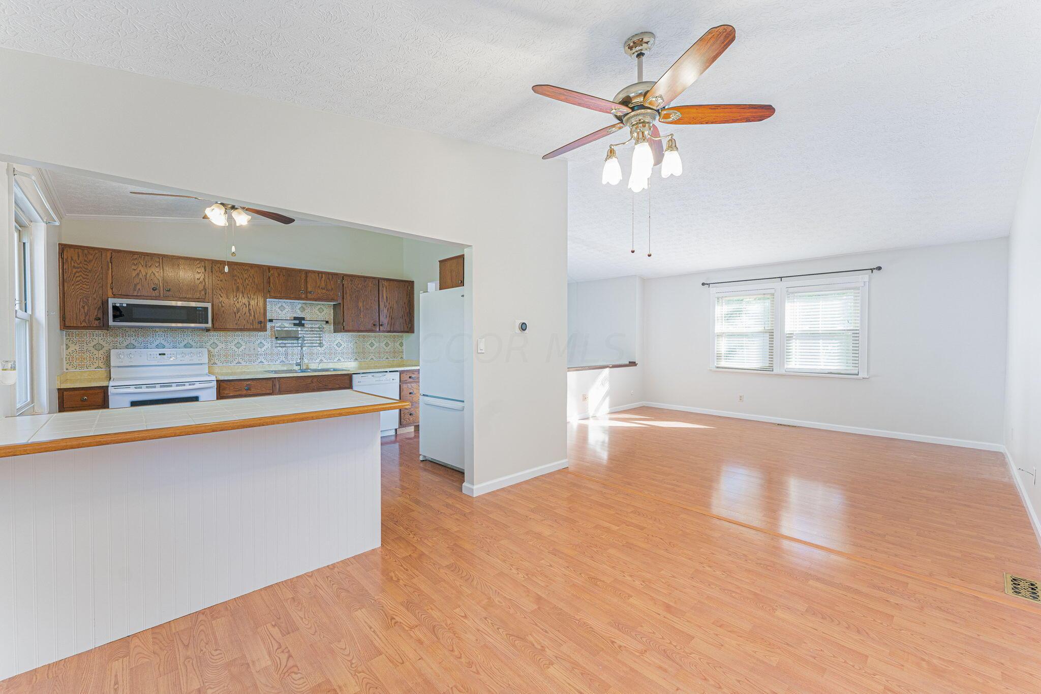 1952 Wolverhampton Road Powell, OH 43065 - Photo 13 of 48 Dining room to living room and kitchen