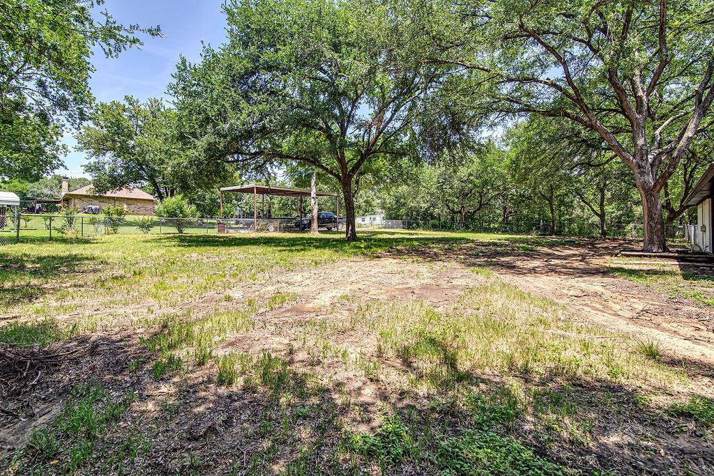 715 Pheasant Run Burleson, TX 76028 - Photo 22 of 28 a view of a yard in front of a house