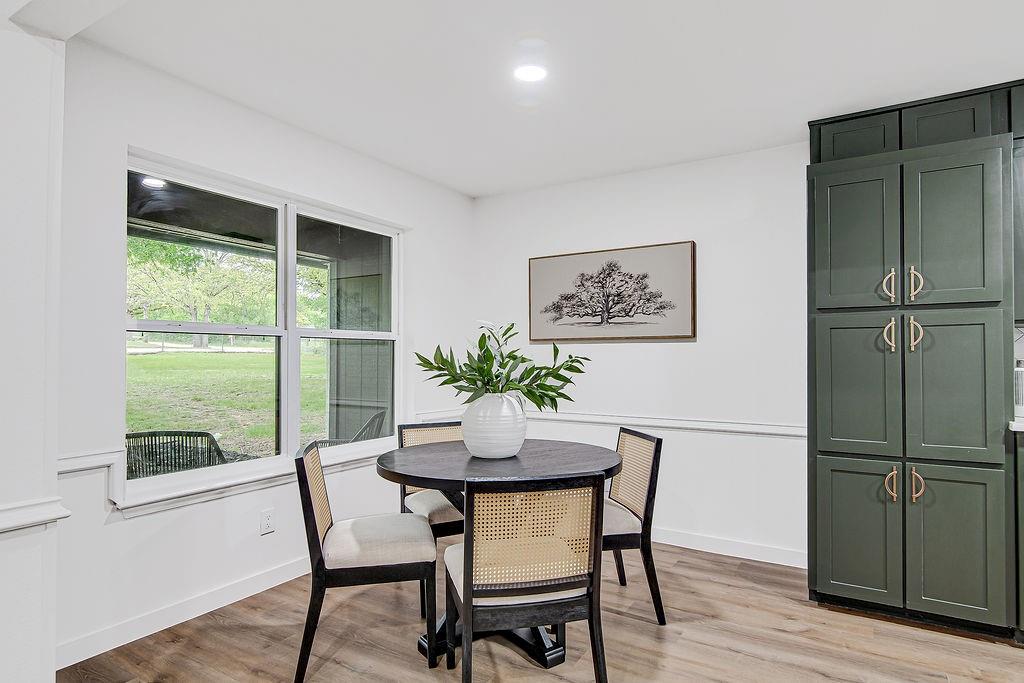715 Pheasant Run Burleson, TX 76028 - Photo 8 of 28 a dining room with furniture and wooden floor