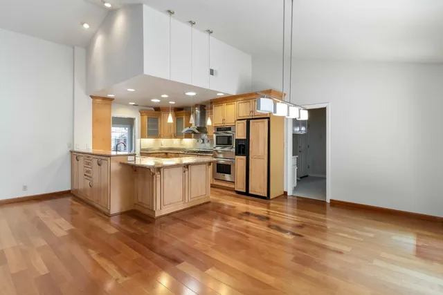 a view of a kitchen with a sink and a floor to ceiling window