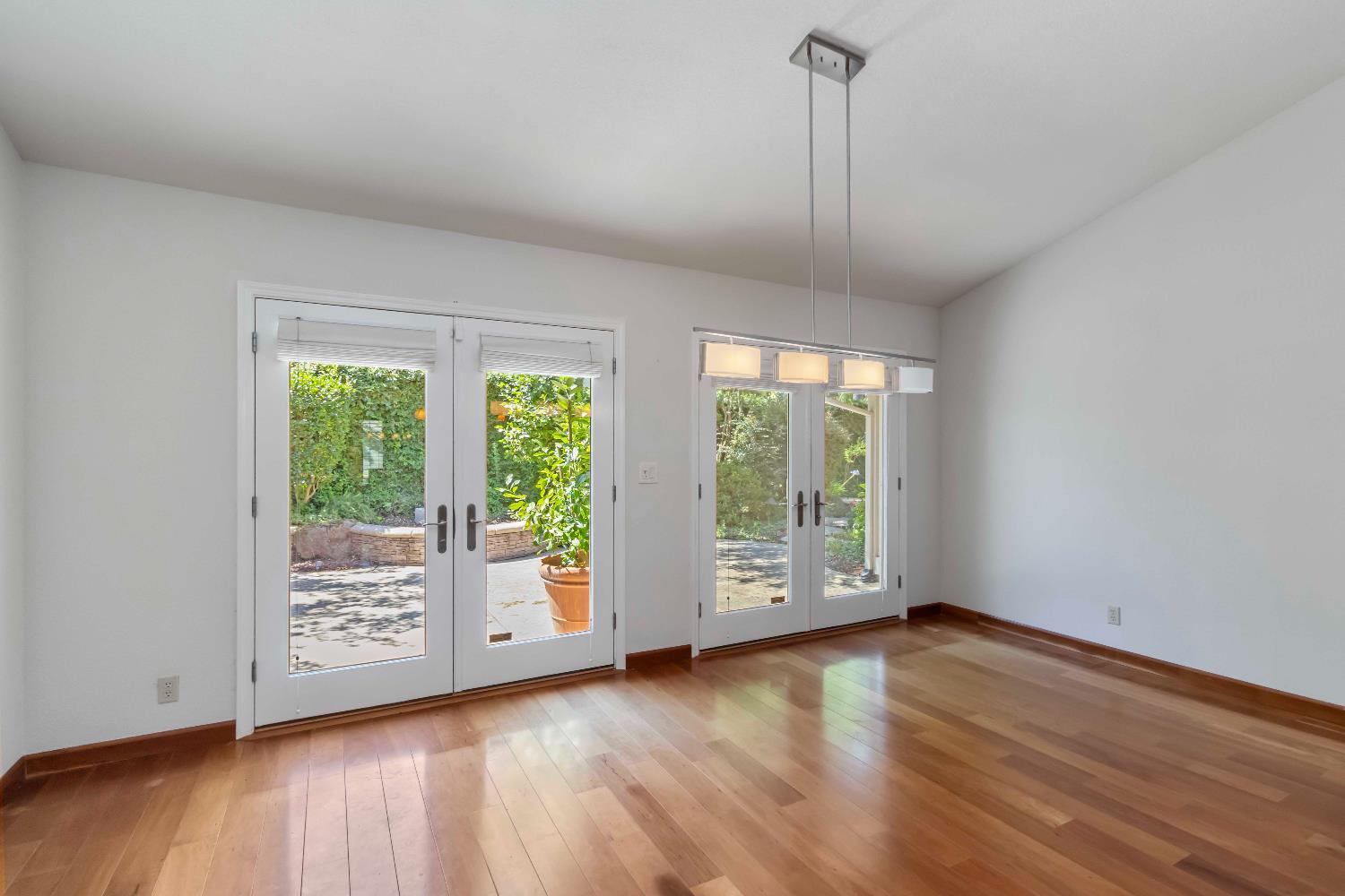 1311 Aberdeen Circle Granite Bay, CA 95746 - Photo 20 of 50 a view of an empty room with wooden floor and a window