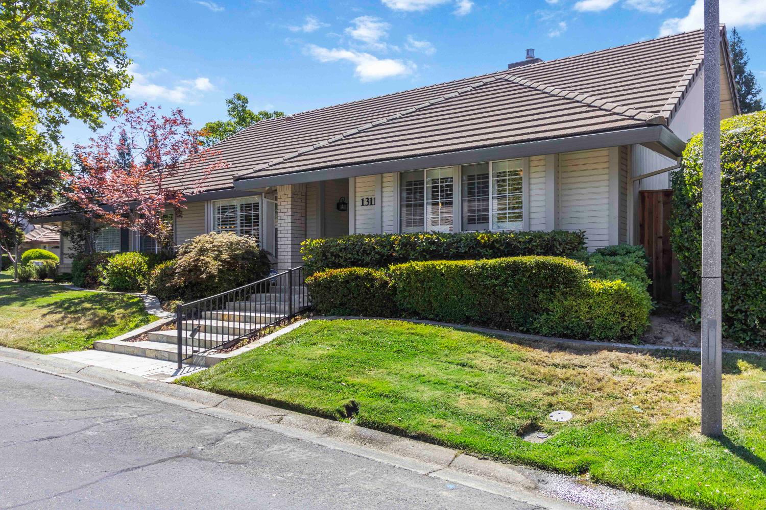 1311 Aberdeen Circle Granite Bay, CA 95746 - Photo 2 of 50 a view of a house with backyard and plants