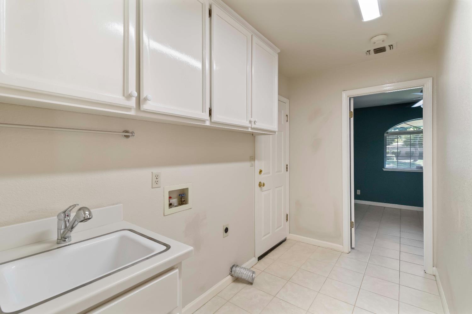 1311 Aberdeen Circle Granite Bay, CA 95746 - Photo 25 of 50 a bathroom with a sink and cabinets