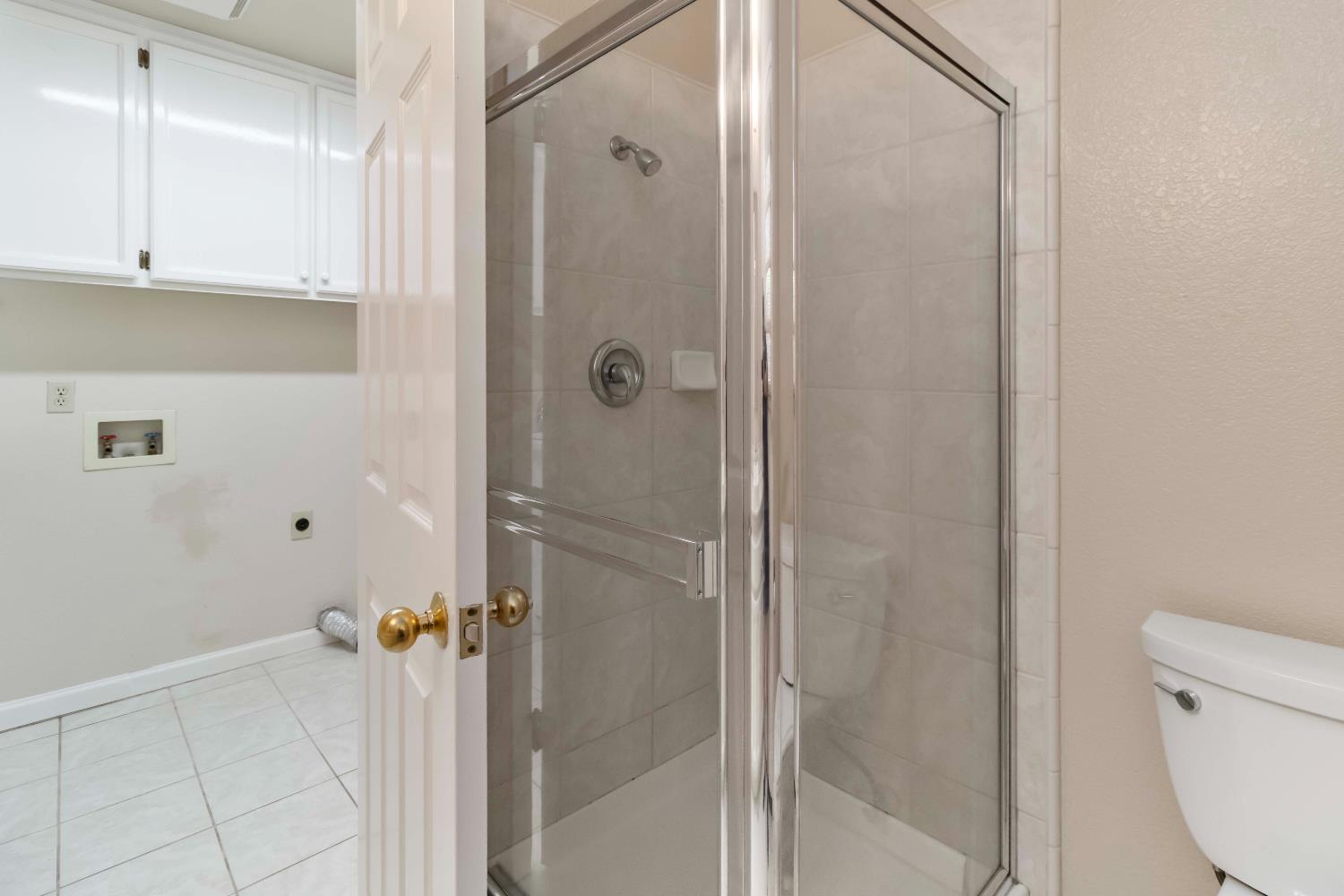 1311 Aberdeen Circle Granite Bay, CA 95746 - Photo 27 of 50 a bathroom with a shower and toilet