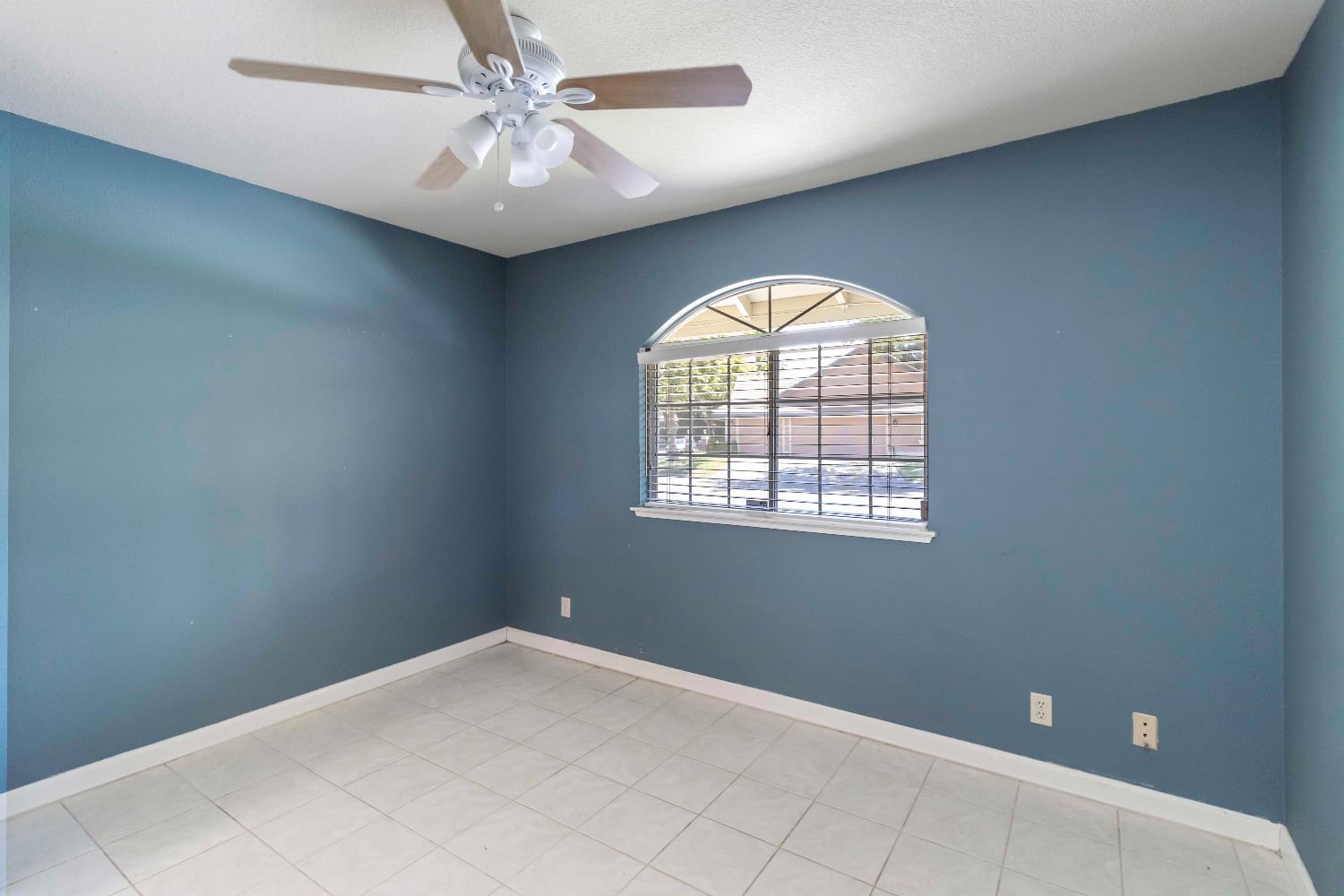 1311 Aberdeen Circle Granite Bay, CA 95746 - Photo 28 of 50 an empty room with windows and ceiling fan