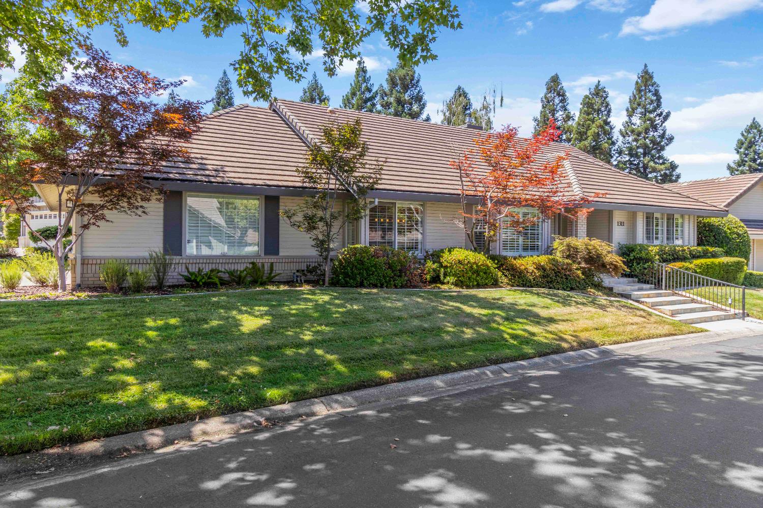 1311 Aberdeen Circle Granite Bay, CA 95746 - Photo 3 of 50 a front view of a house with garden