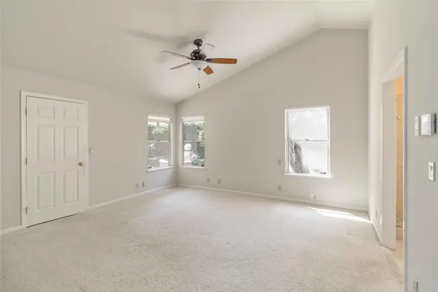 a view of a kitchen with white cabinets