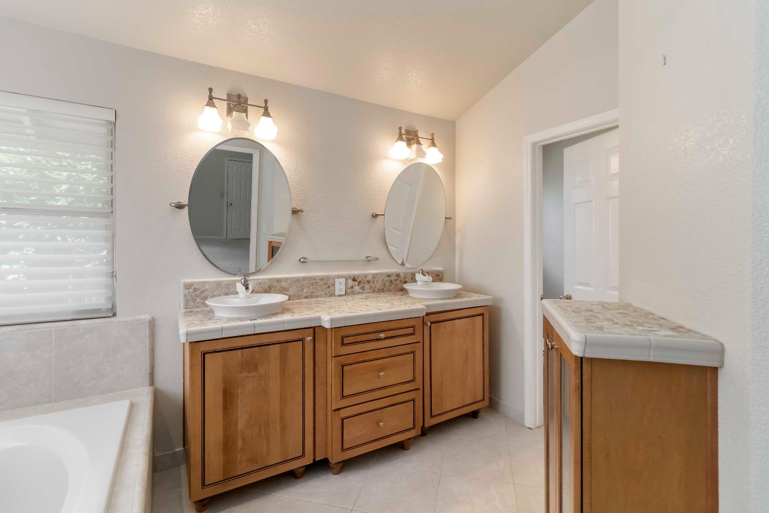 1311 Aberdeen Circle Granite Bay, CA 95746 - Photo 41 of 50 a bathroom with a double vanity sink and a mirror