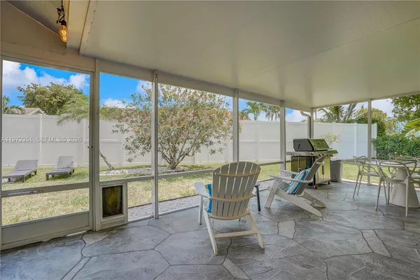 a view of living room filled with furniture and a table