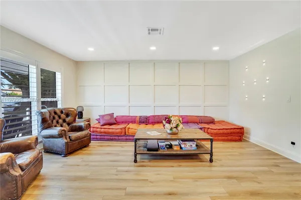 a living room with furniture and a table