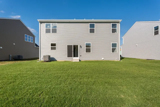 a front view of house with yard