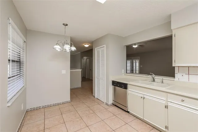 a spacious bathroom with a granite countertop sink a mirror and a shower