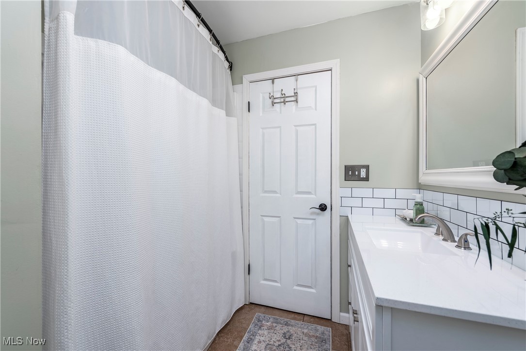 8767 Edgehill Road Mentor, OH 44060 - Photo 22 of 47 Bathroom featuring vanity and tile patterned flooring
