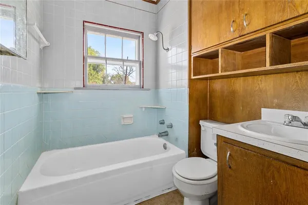 a bathroom with a sink and a toilet