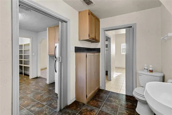 a bathroom with a shower and a toilet