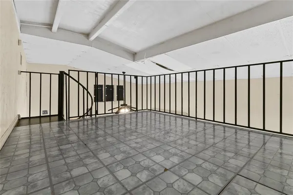 a view of staircase with white walls