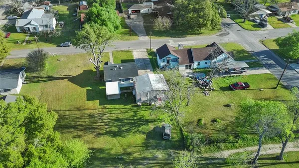 an aerial view of residential house with outdoor space and swimming pool