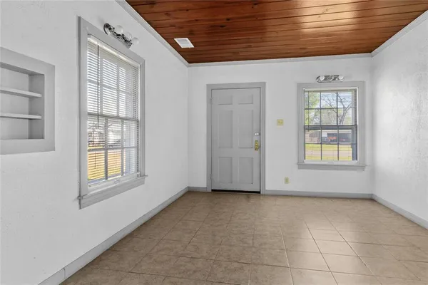 a view of an empty room with a window