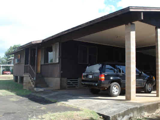 3327 A Puni Road Koloa, HI 96756 - Photo 5 of 6 a car parked in front of a house