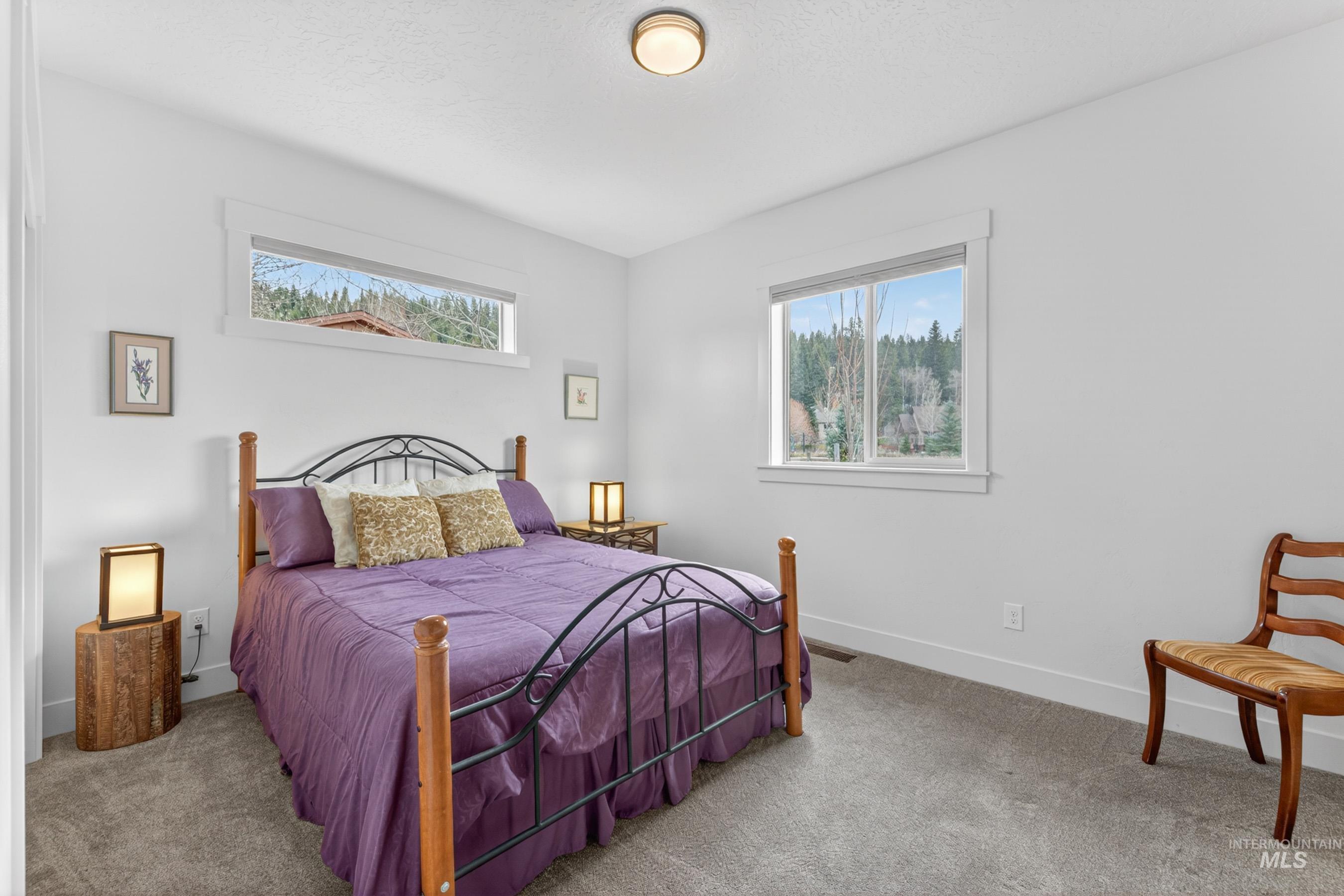 1126 Mo's Way McCall, ID 83638 - Photo 34 of 50 Bright interior with a window offering glimpses of the surrounding natural scenery